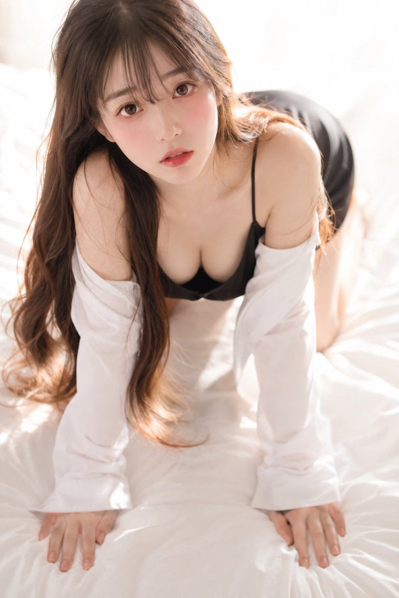 A soft, intimate 35mm photograph shot from slightly above, looking down…