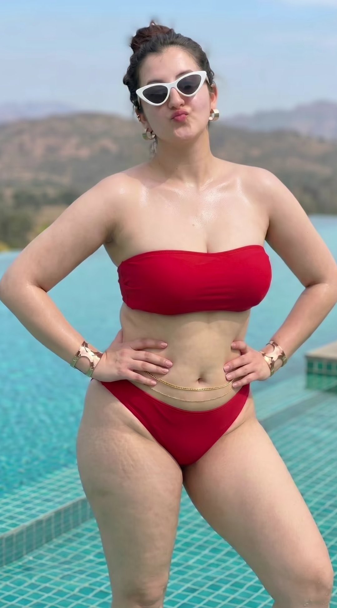 A stunning photorealistic portrait of a confident curvy Indian woman st…