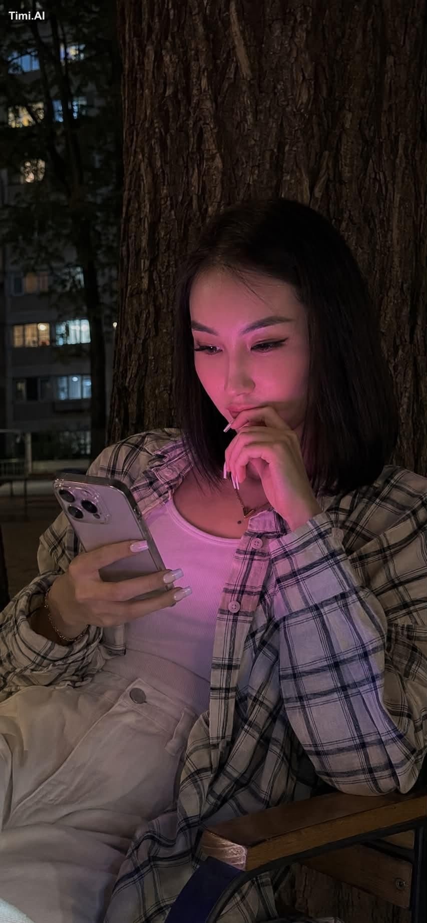 Realistic lifestyle photo shot on an iPhone 15 Pro at night. In the cen…