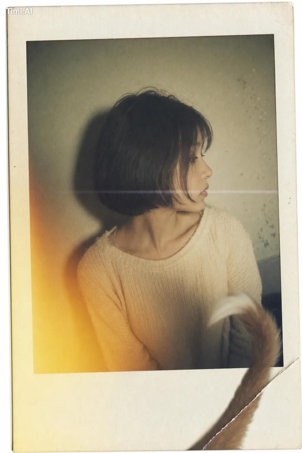 A vintage Polaroid instant photograph with a classic thick white border… 1