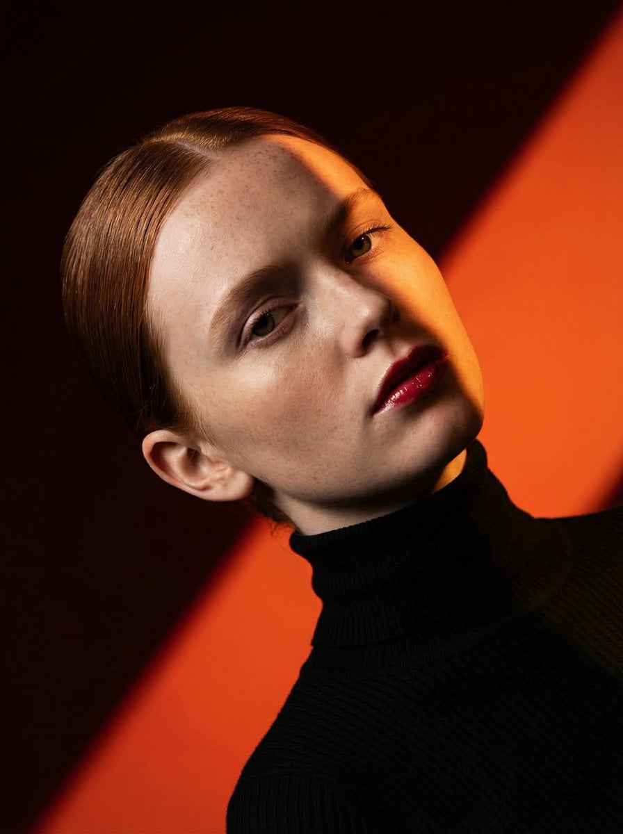 Ultra-high-fashion editorial beauty portrait of a fair-skinned female m…