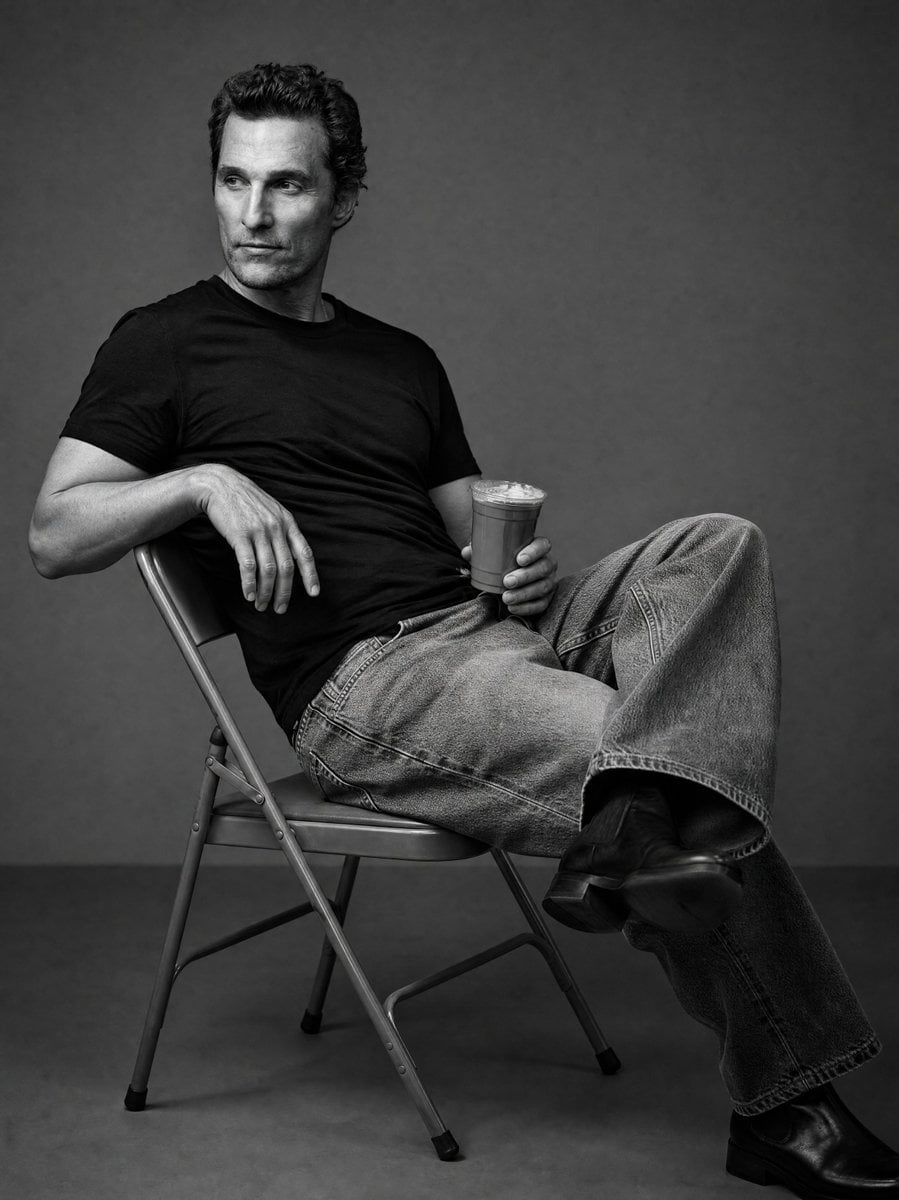 Create a black and white studio image of the person in the uploaded ima…