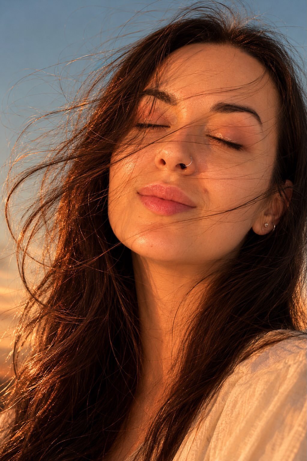 Ultra-realistic golden hour close-up portrait of a young woman outdoors… 1