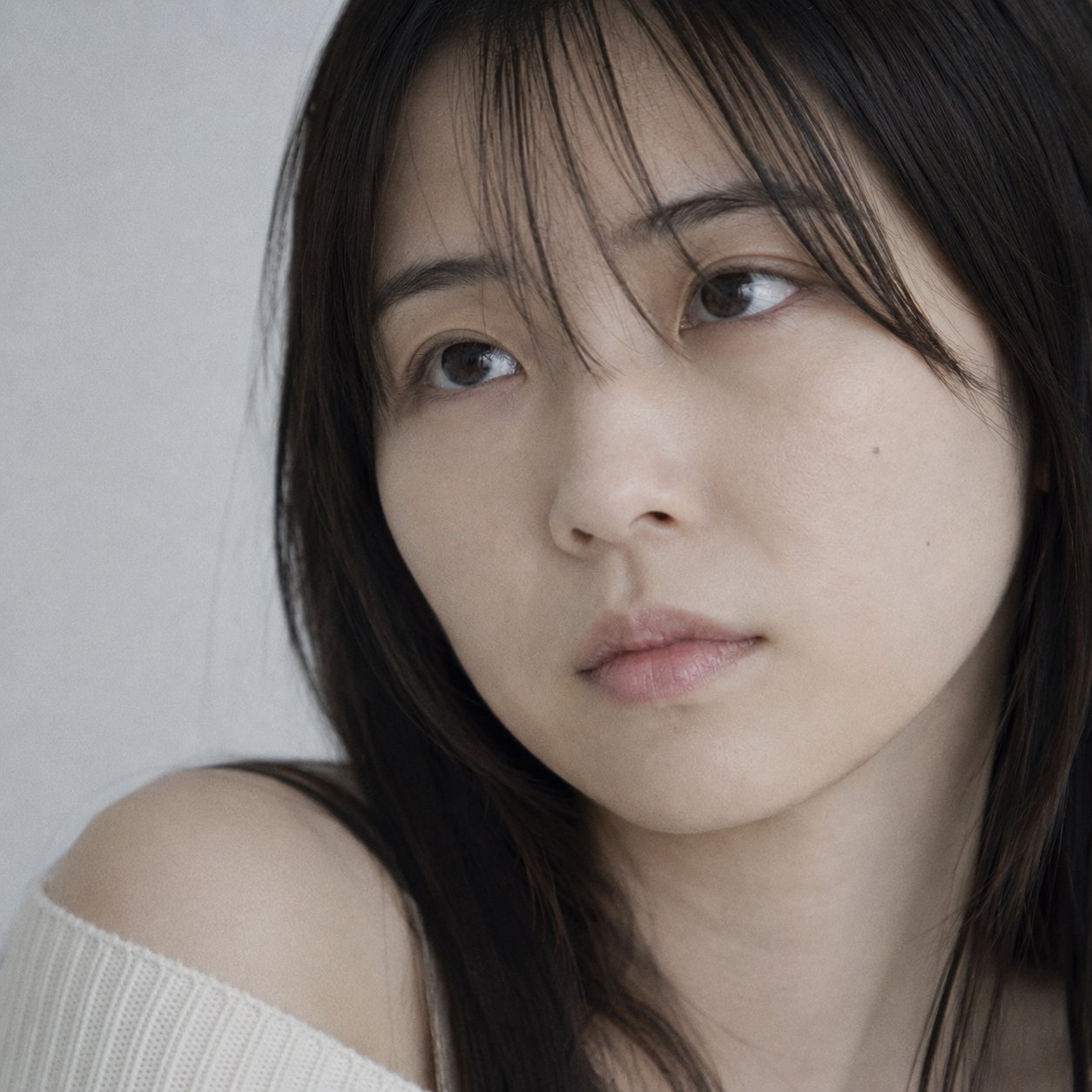 Portrait shot on 85mm f/1.8, tight close-up face portrait of a Japanese… 1