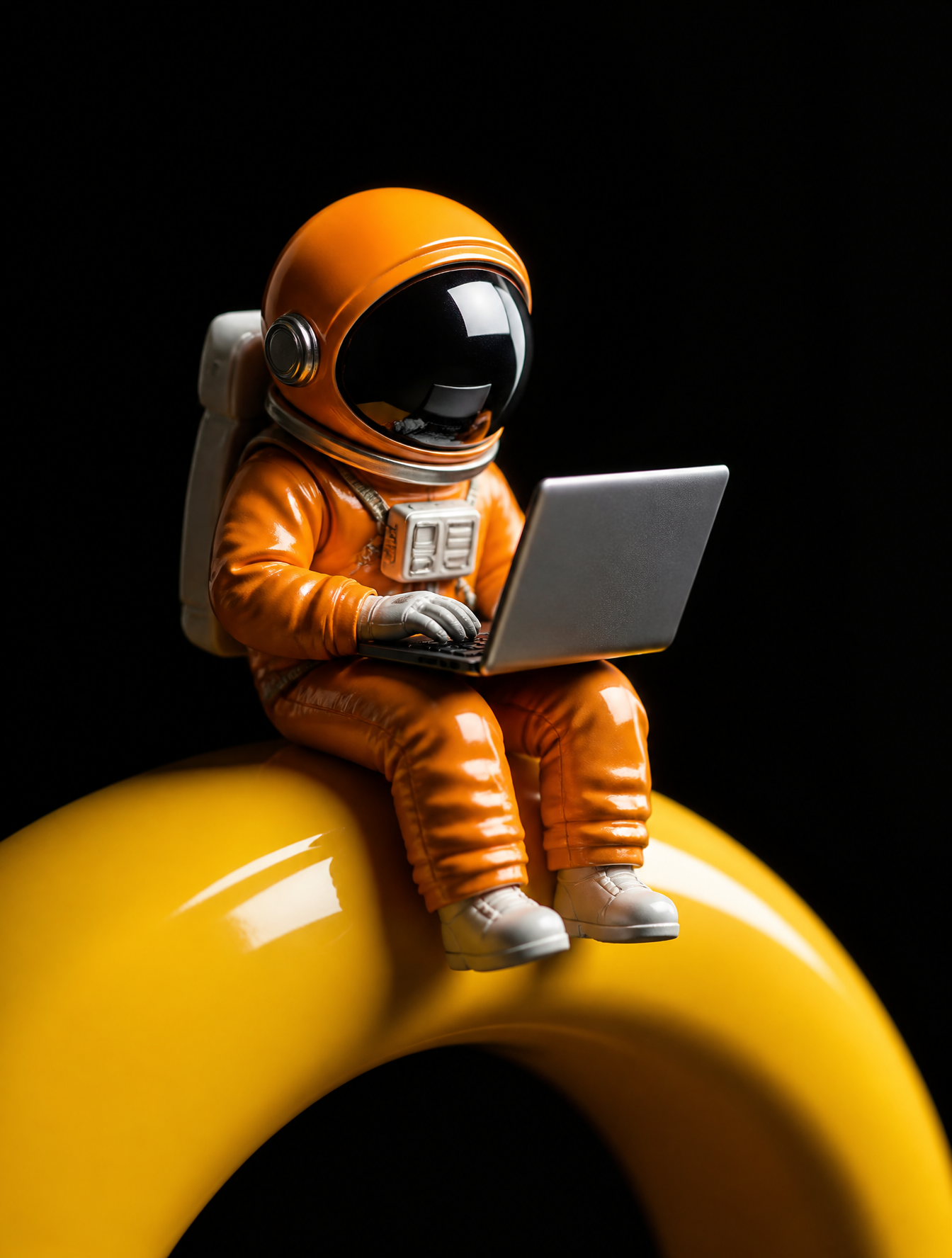 A stylized miniature astronaut in a vibrant orange pressure suit sits p…