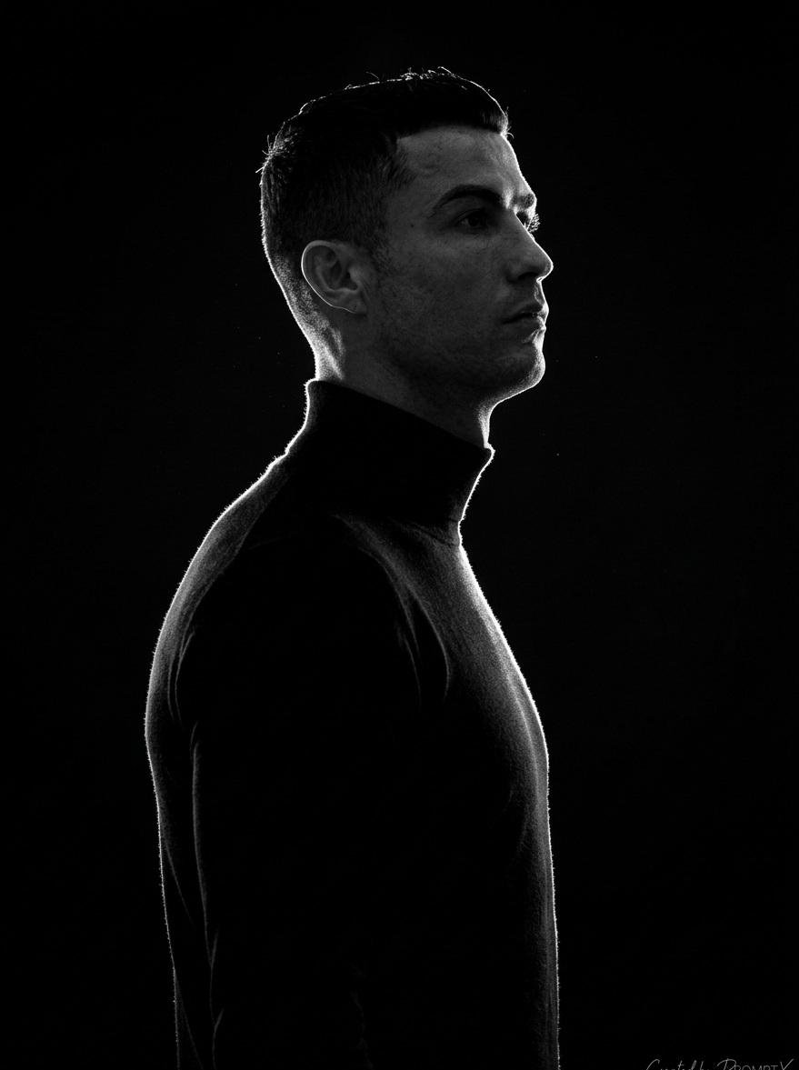 A stark, high-contrast, black-and-white (monochromatic) side-profile po…