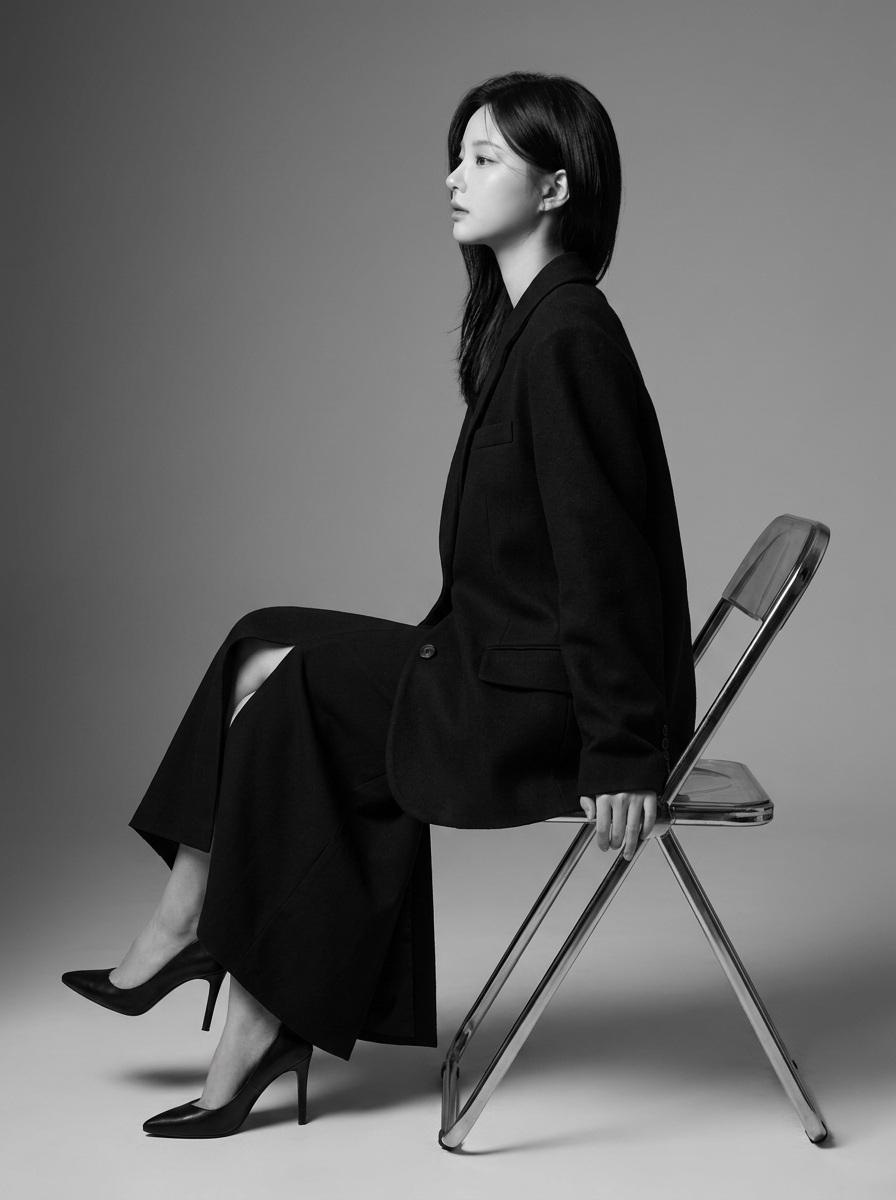 Create a highly realistic 8K professional black-and-white fashion edito…