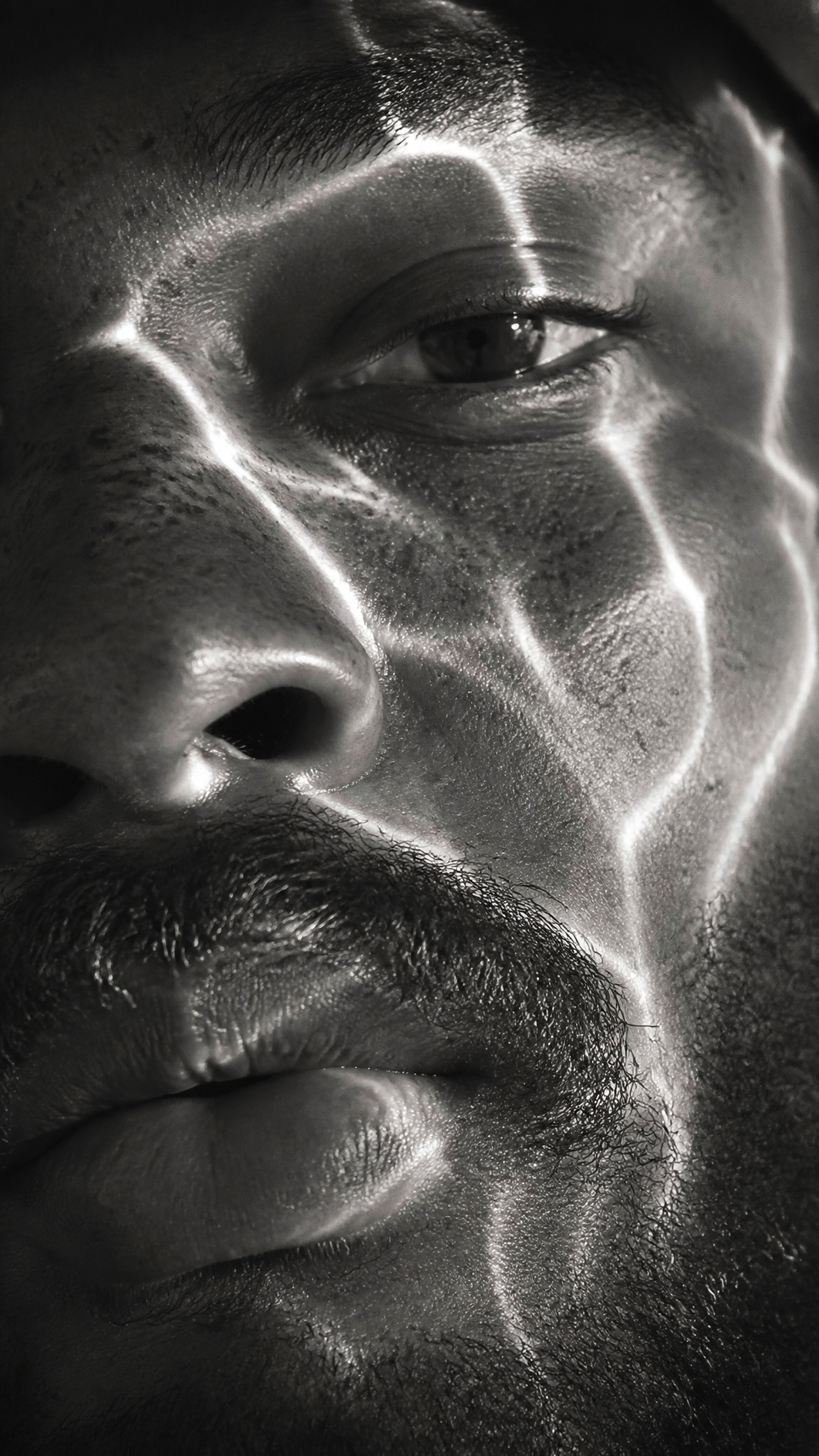 A hyperrealistic 8K black and white extreme close-up portrait of a youn…