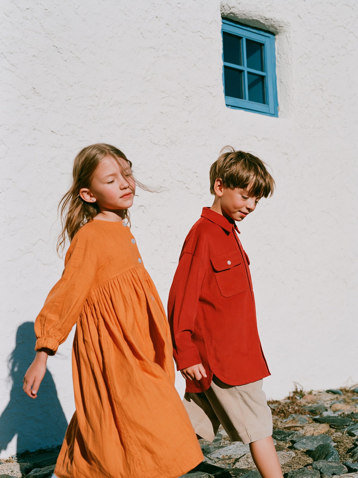 High-fashion children's commercial full-body shot, three-quarter side p…