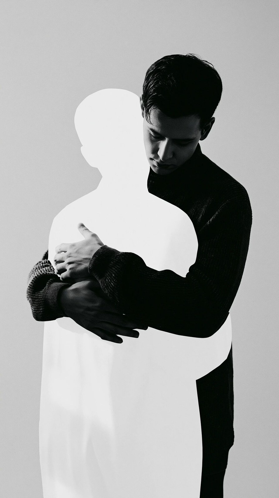 Minimalist conceptual collage artwork. A realistic man in a dark sweate…