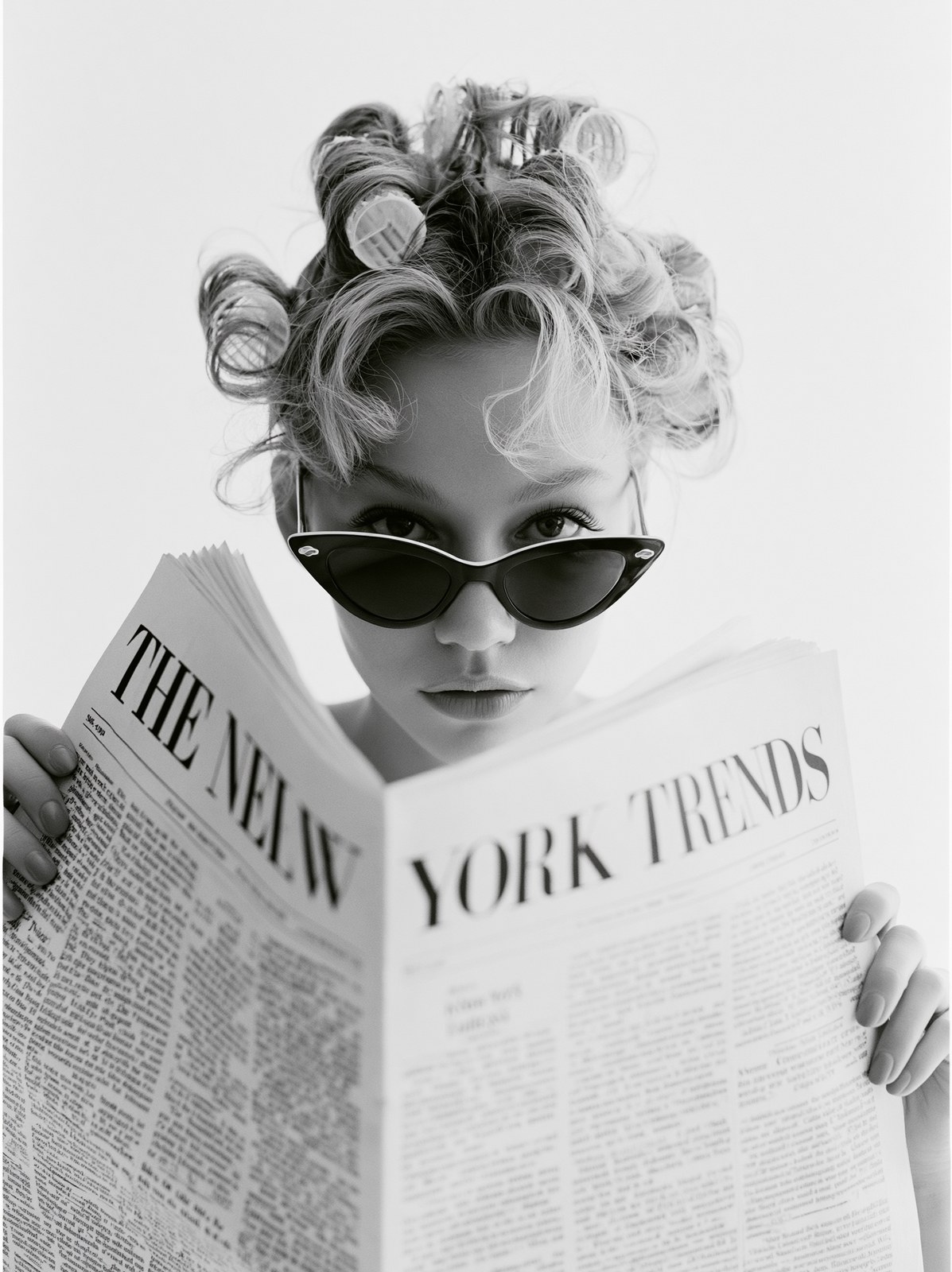 A hyper-realistic black and white close-up photograph of a blonde woman…